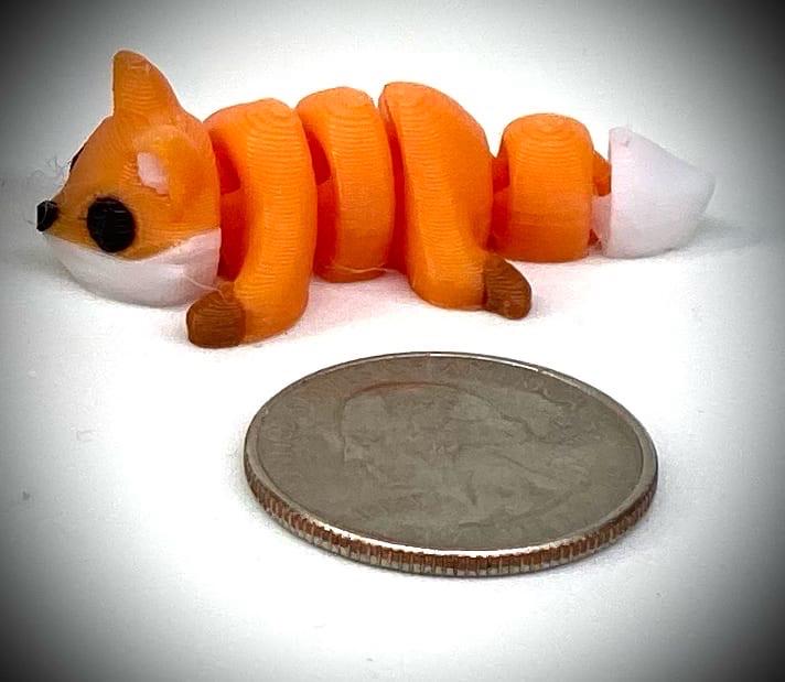 3d printed tiny articulated creatures, designed by Zou. Box of random minis.