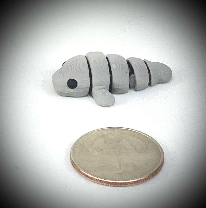 3d printed tiny articulated creatures, designed by Zou. Box of random minis.