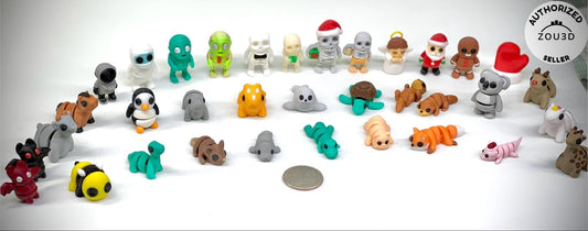 3d printed tiny articulated creatures, designed by Zou. Box of random minis.