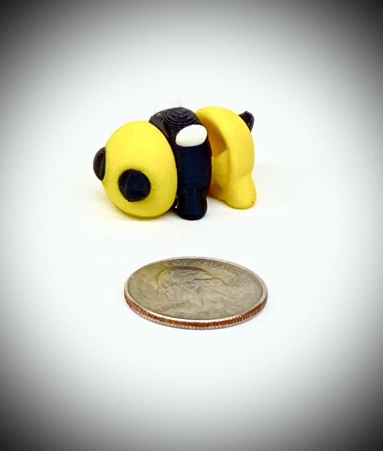 3d printed tiny articulated creatures, designed by Zou. Box of random minis.