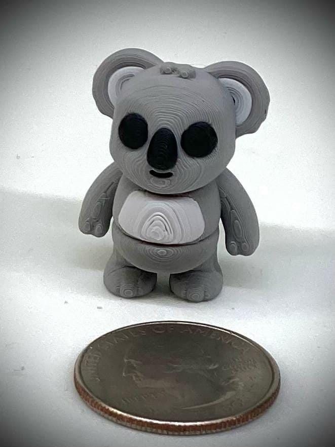 3d printed tiny articulated creatures, designed by Zou. Box of random minis.
