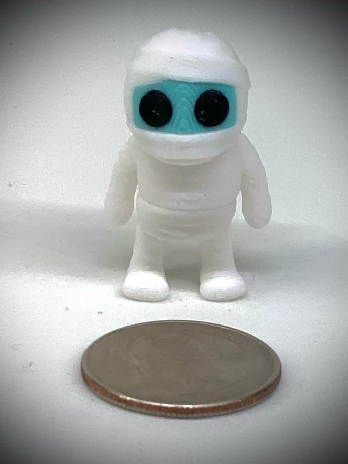 3d printed tiny articulated creatures, designed by Zou. Box of random minis.